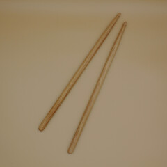 Percussion drumsticks on a cream background.