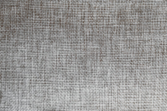 Gray linen fabric as a background texture. Top view. Copy, empty space for text