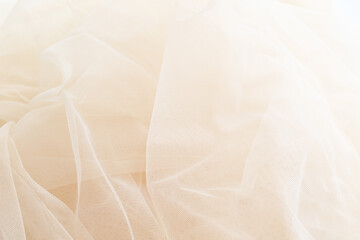 light smooth beige tulle fabric background