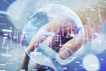 Multi exposure of man's hands holding and using a phone and financial chart drawing. Market analysis concept.