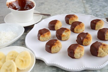 Banana coconut cookies dipped in chocolate sauce