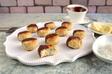 Banana coconut cookies dipped in chocolate sauce