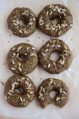 Vegan gluten free bagels topped with sunflower seeds, flax seeds and sesame seeds. Healthy breakfast food. 