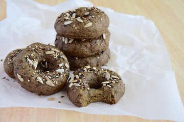 Vegan gluten free bagels topped with sunflower seeds, flax seeds and sesame seeds. Healthy breakfast food. 