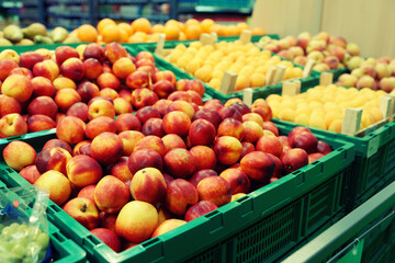 Peaches and apricots in a supermarket, toned