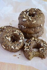 Vegan gluten free bagels topped with sunflower seeds, flax seeds and sesame seeds. Healthy breakfast food. 