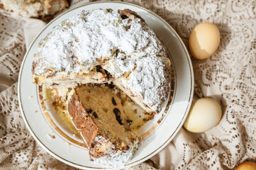Sliced Easter cake and Easter eggs
