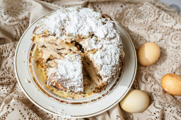 Sliced Easter cake and Easter eggs