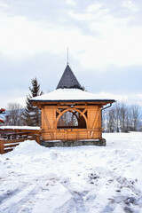 Wooden hut in snow on mountains