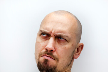 a man's face with a beard and bald, different expressions of emotion,