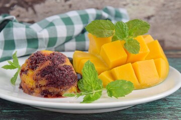 Homemade mango blueberry sorbet garnish with mint leaf