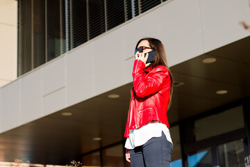 Woman talking on the phone outdoors