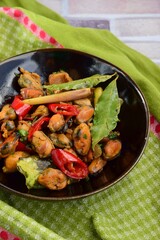 Oseng Kerang Saus Tiram, Indonesian food. Stir-fried mussels with oyster sauce, soy sauce, lemongrass, bayleaf, ginger, garlic and chili.
