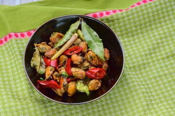 Oseng Kerang Saus Tiram, Indonesian food. Stir-fried mussels with oyster sauce, soy sauce, lemongrass, bayleaf, ginger, garlic and chili.