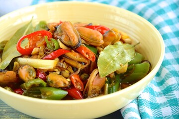 Oseng Kerang Saus Tiram, Indonesian food. Stir-fried mussels with oyster sauce, soy sauce, lemongrass, bayleaf, ginger, garlic and chili.