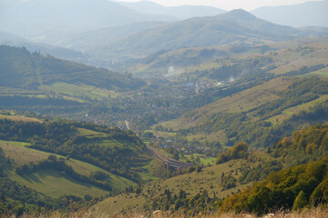 Fototapeta na wymiar Panorama view of beautiful Carpathian mountains and village