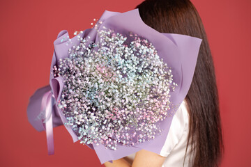 The girl with huge bouquet of gypsophila
