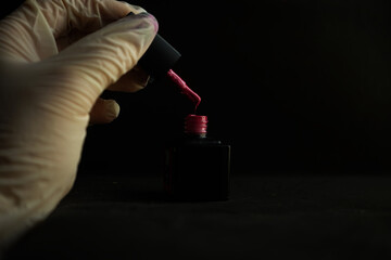 hand holding a microscope