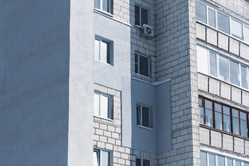 Apartment building with a gray wall insulated with foam