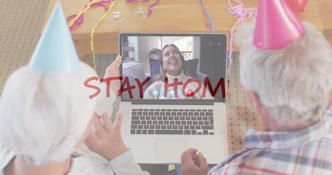 Coronavirus concept text against senior couple celebrating birthday on video call at home