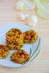 Healthy cauliflower red bell pepper patties. Vegan food
