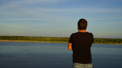 woman standing by the lake