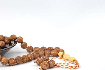 Fototapeta na wymiar Ramadan concept with prayer beads and plate