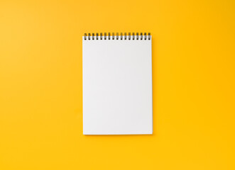 notebook on yellow background