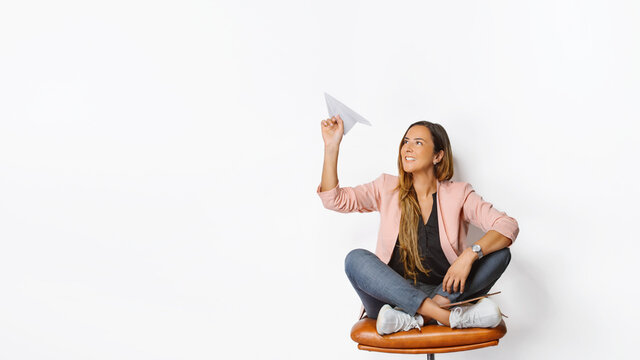 A Bussines Woman With The Paper Airplane On The Isolated White Background