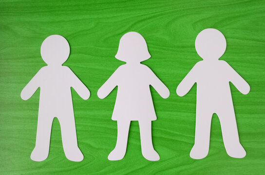 Paper cutout of a man, woman and man