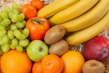 Fototapeta na wymiar Juicy fruits. Assorted ripe fruits. Fruit basket