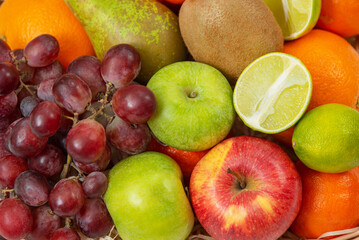 Grapes with apples in a basket. Fruit summer platter