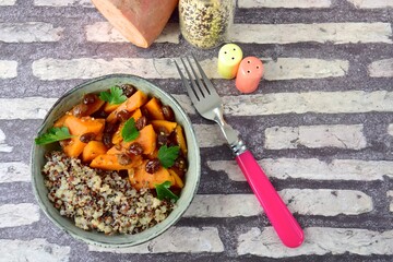 Cooked red and white quinoa with sweet potato, raisin and parsley. Healthy vegan food. Flat lay