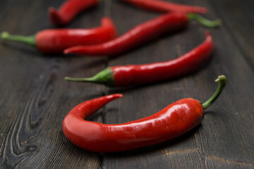 hot chili peppers red wooden table cooking food ingredients