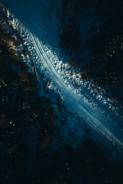 Forest road during winter from above