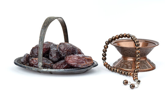 Dates on a bronze plate isolated