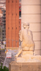 Fototapeta na wymiar Portrait to a statue with a view of Barcelona