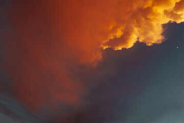 fire in the clouds, orange clouds and moon 