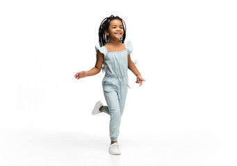 Happy longhair brunette little girl isolated on white studio background with copyspace for ad. Looks happy, cheerful, sincere. Childhood, education, human emotions, facial expression concept.