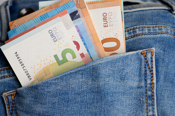 Obraz premium close up of different Euro banknotes in a jeans pocket