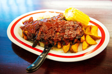 Grilled steak - Grilled meat, ribs on the plate with hot sauce