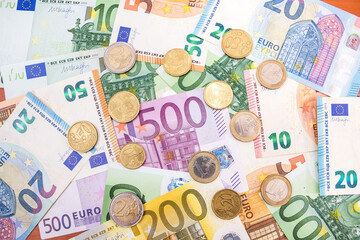 background of different euro banknotes and coins.