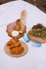Beautiful autumn picnic on the lake at sunset