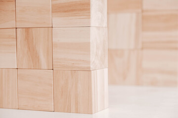 Wooden cubes from natural wood on a white background. Copy, empty space for text