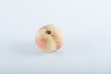 Tasty fresh peach on white background with shadow