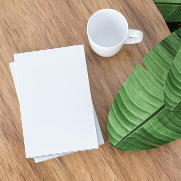 white cup of coffee on wooden table with book mock up,3d rendering.