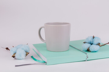 workplace background with notepad and cup on white background