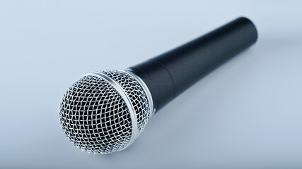 microphone in cool metallic tones, shallow depth of field
