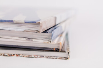 books are in a pile on top of each other on a white background