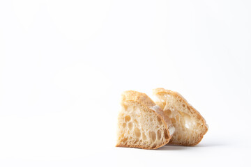 Two pieces of white wheat bread with intoxicated sourdough. White background